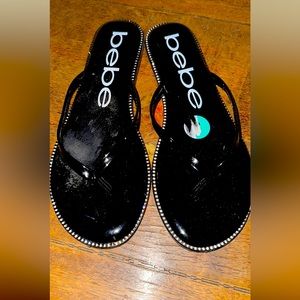 Bebe flip flops size 8. Never worn.